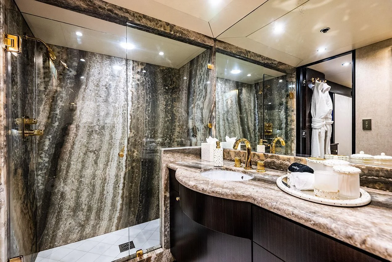 a bathroom with a large marble countertop aboard GRADE I Yacht for Charter