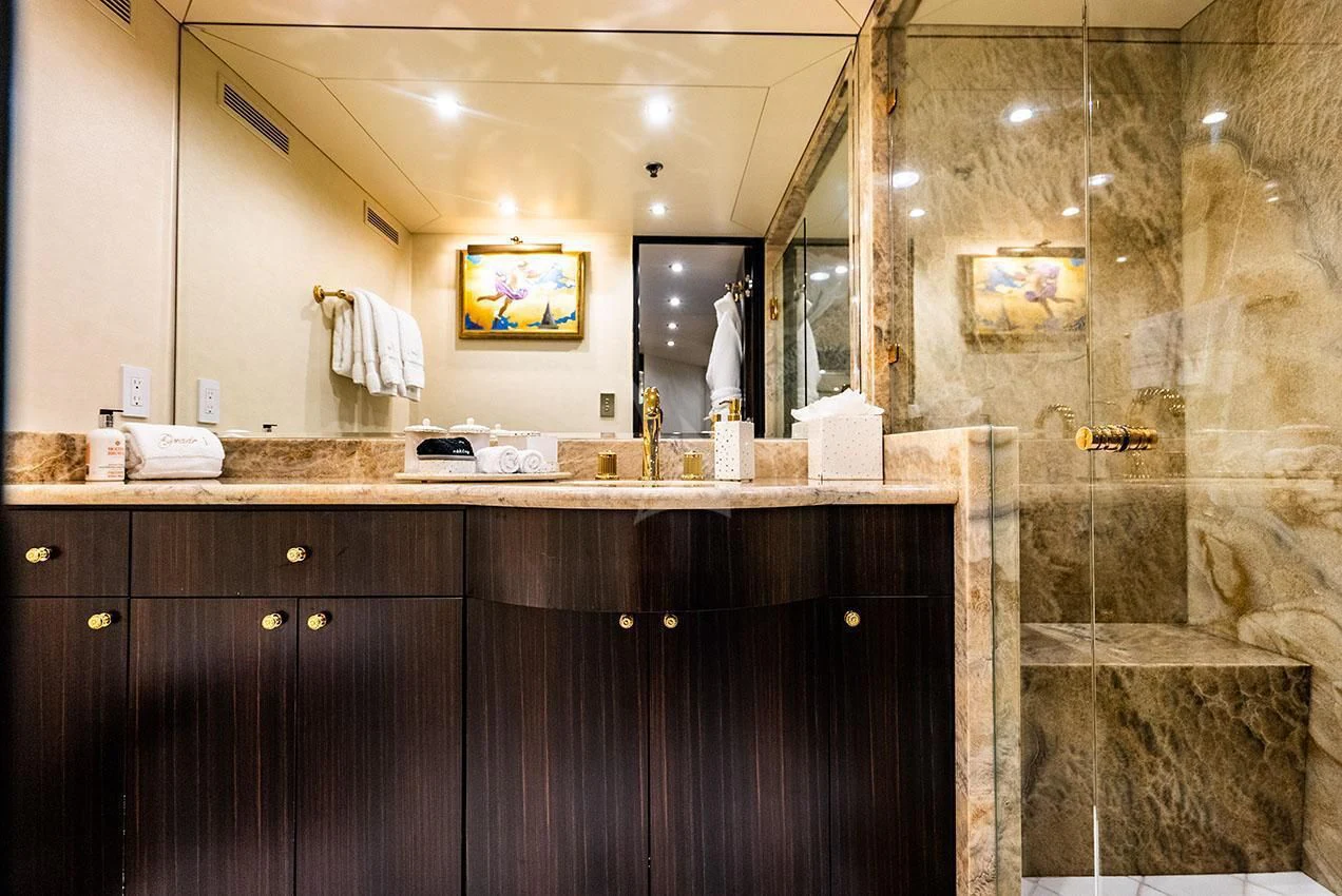 a bathroom with a large mirror aboard GRADE I Yacht for Charter