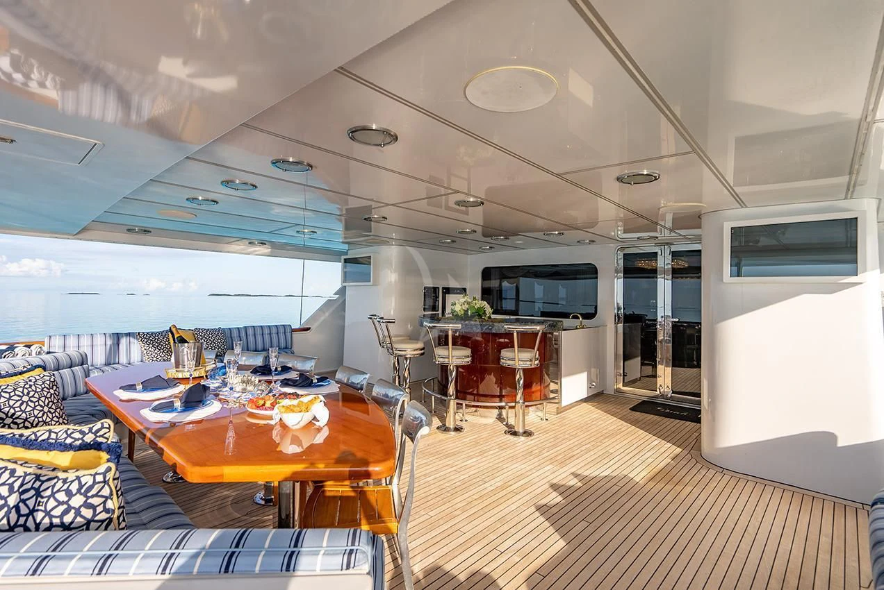 a room with a table and chairs aboard GRADE I Yacht for Charter