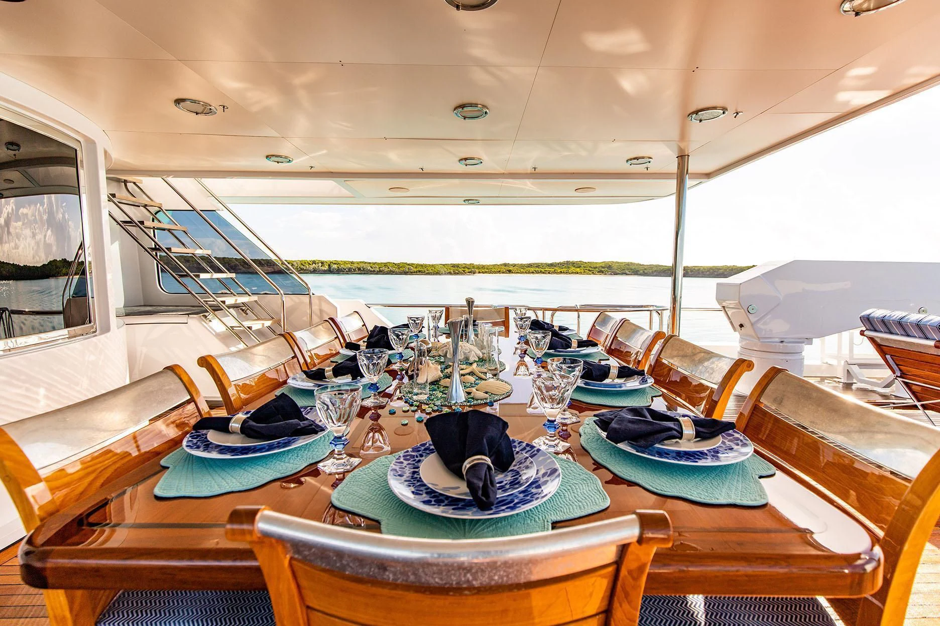 a table with plates and glasses on it aboard GRADE I Yacht for Charter