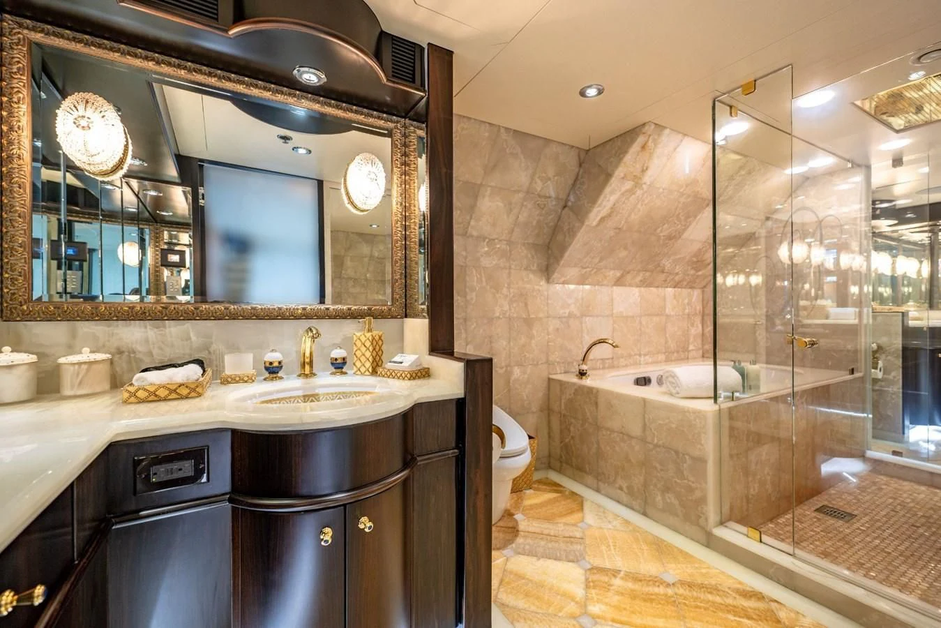 a bathroom with a large mirror aboard GRADE I Yacht for Charter