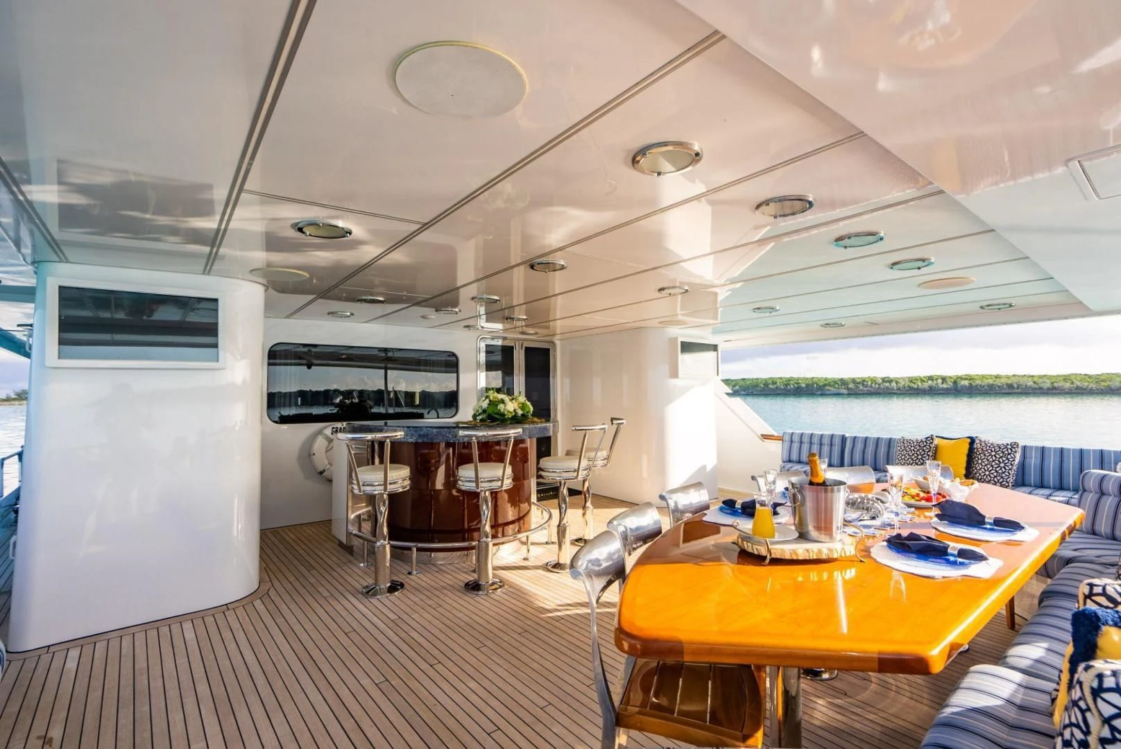 a room with tables and chairs aboard GRADE I Yacht for Charter