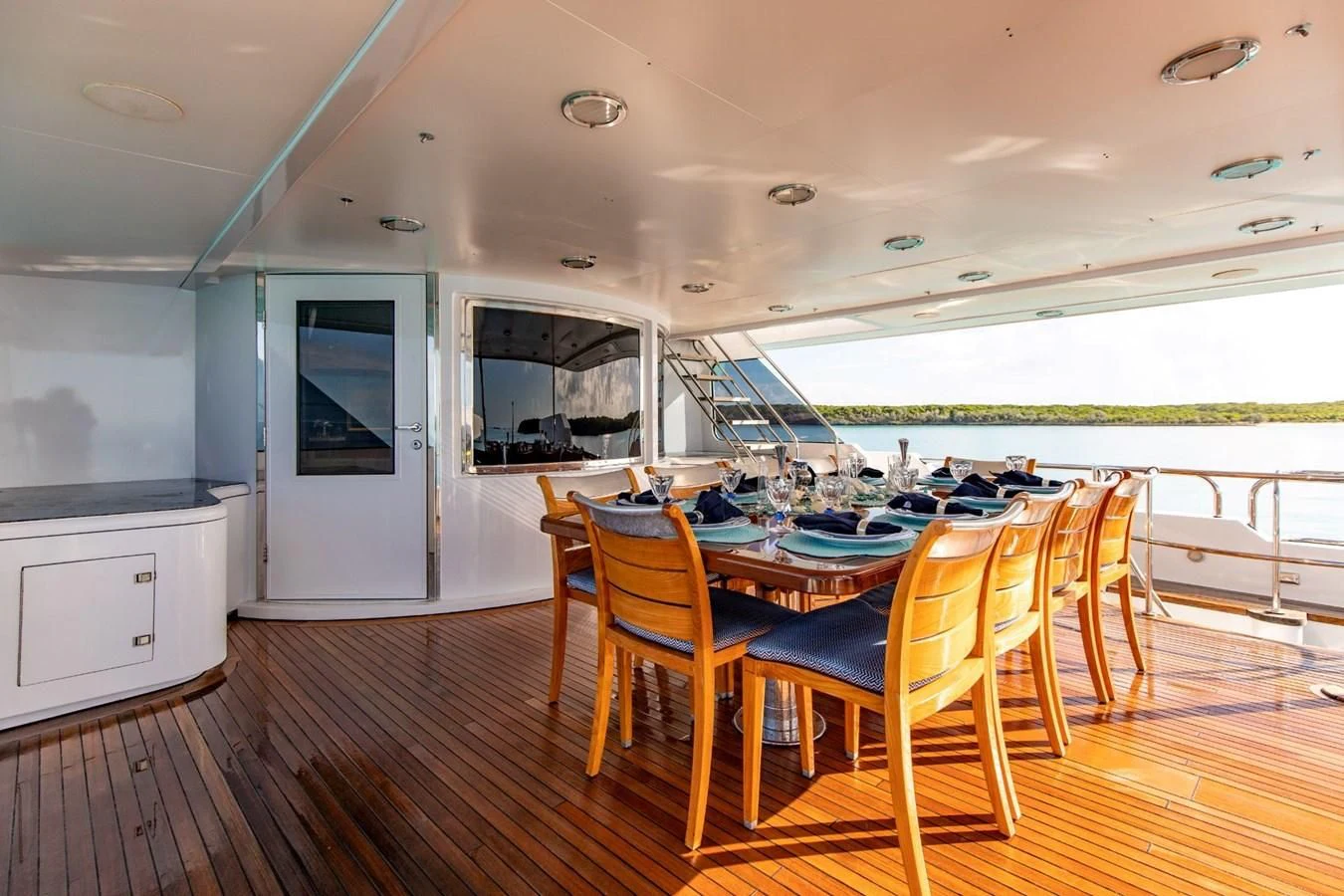 a dining room with a table and chairs aboard GRADE I Yacht for Charter