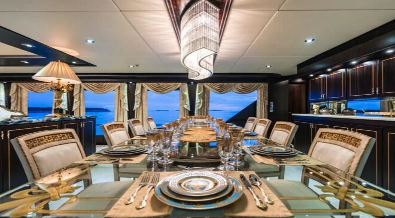 a dining room with a table set aboard GRADE I Yacht for Charter