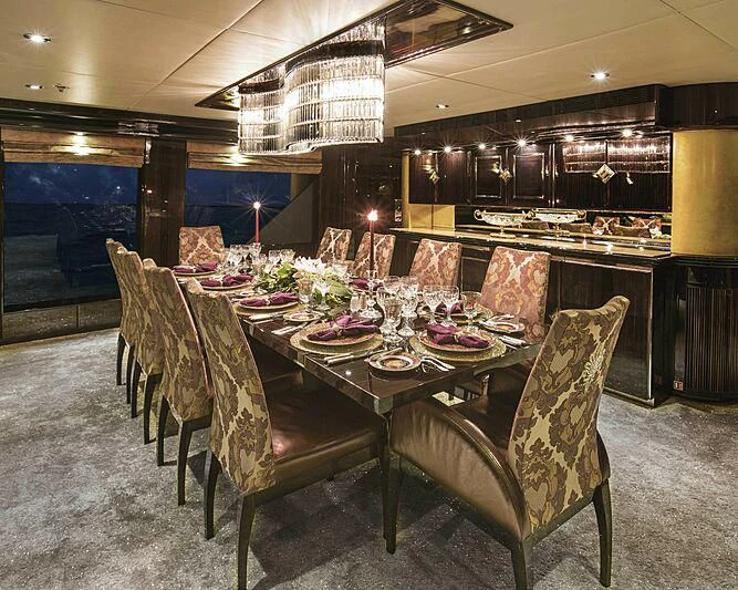 a table set for a dinner party aboard GRADE I Yacht for Charter