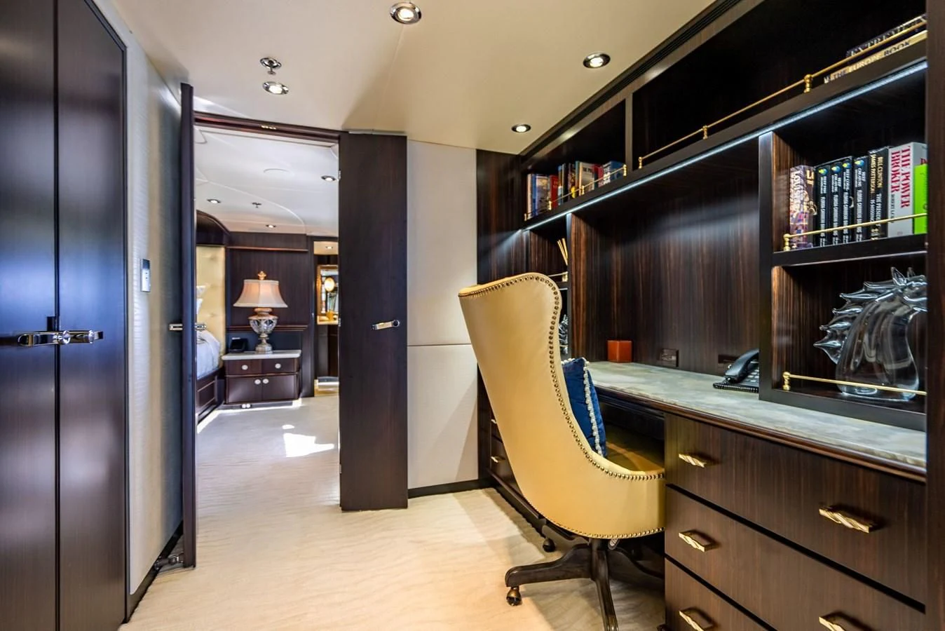 a room with a desk and a chair aboard GRADE I Yacht for Charter