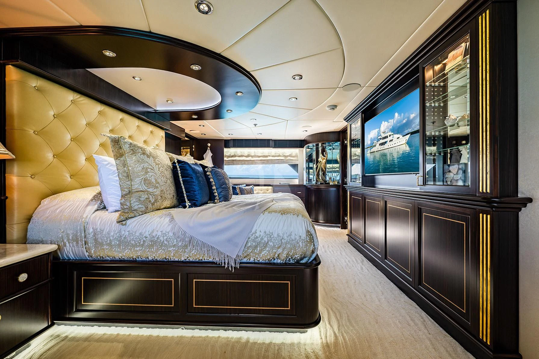 a bedroom with a large bed aboard GRADE I Yacht for Charter