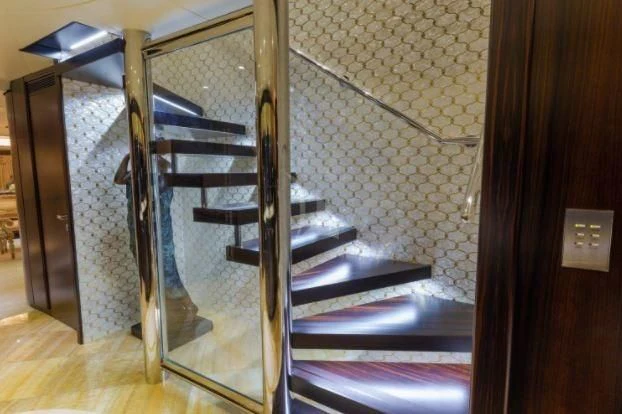 a glass door leading to a bed aboard GRADE I Yacht for Charter