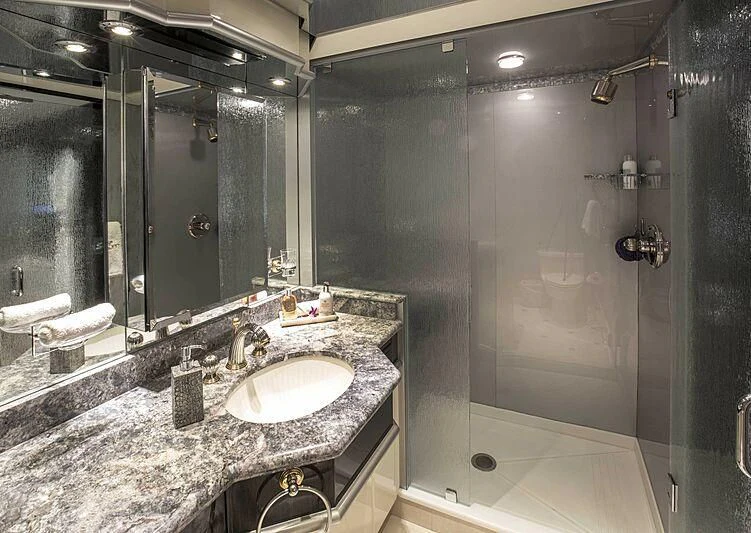 a bathroom with a large marble countertop aboard GRADE I Yacht for Charter