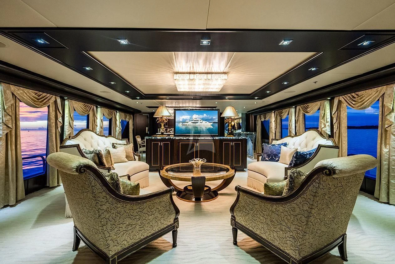 a living room with a couch and a television aboard GRADE I Yacht for Charter