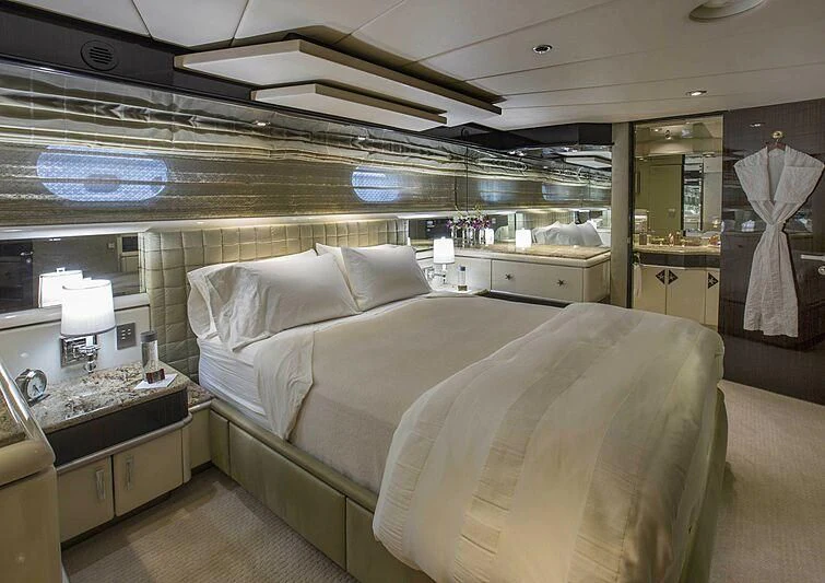 a room with a bed and a sink aboard GRADE I Yacht for Charter