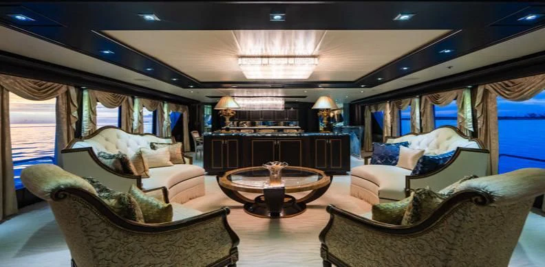 a large room with a table and chairs aboard GRADE I Yacht for Charter