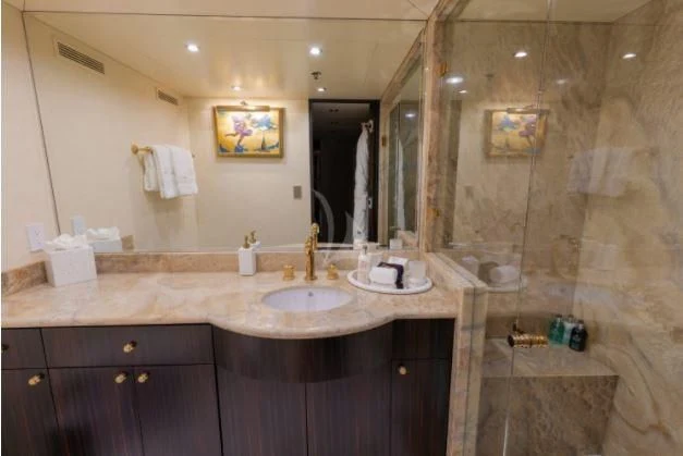 a bathroom with a large mirror aboard GRADE I Yacht for Charter