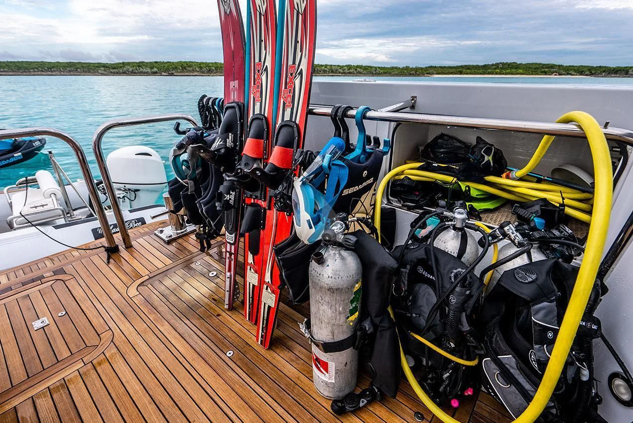 a yellow and red boat on a body of water aboard GRADE I Yacht for Charter