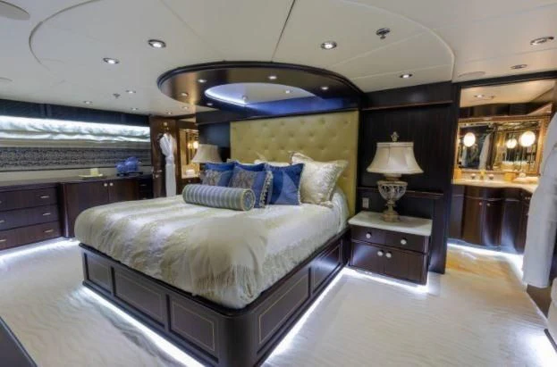 a large bedroom with a large bed aboard GRADE I Yacht for Charter