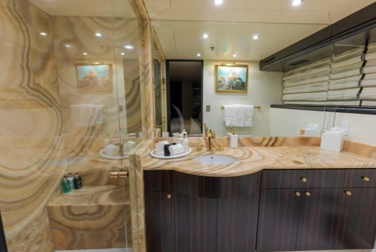 a bathroom with a sink and a mirror aboard GRADE I Yacht for Charter