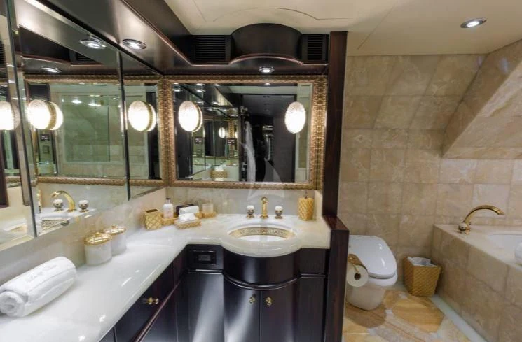 a bathroom with a large mirror aboard GRADE I Yacht for Charter