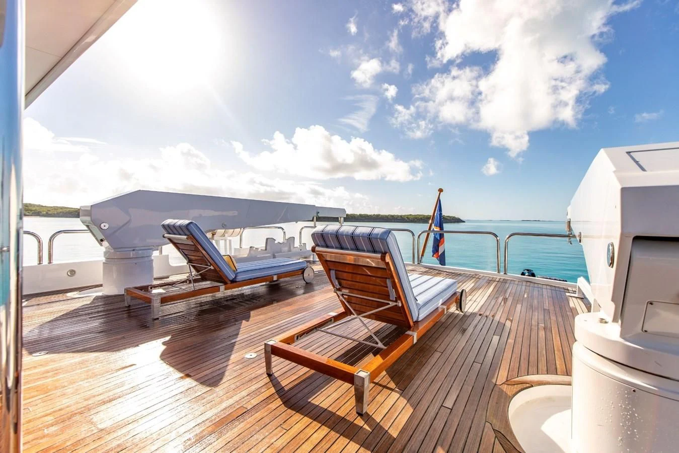 a deck with chairs on it aboard GRADE I Yacht for Charter
