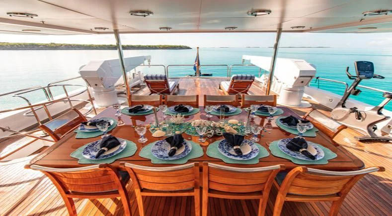 a table with plates and cups on it aboard GRADE I Yacht for Charter