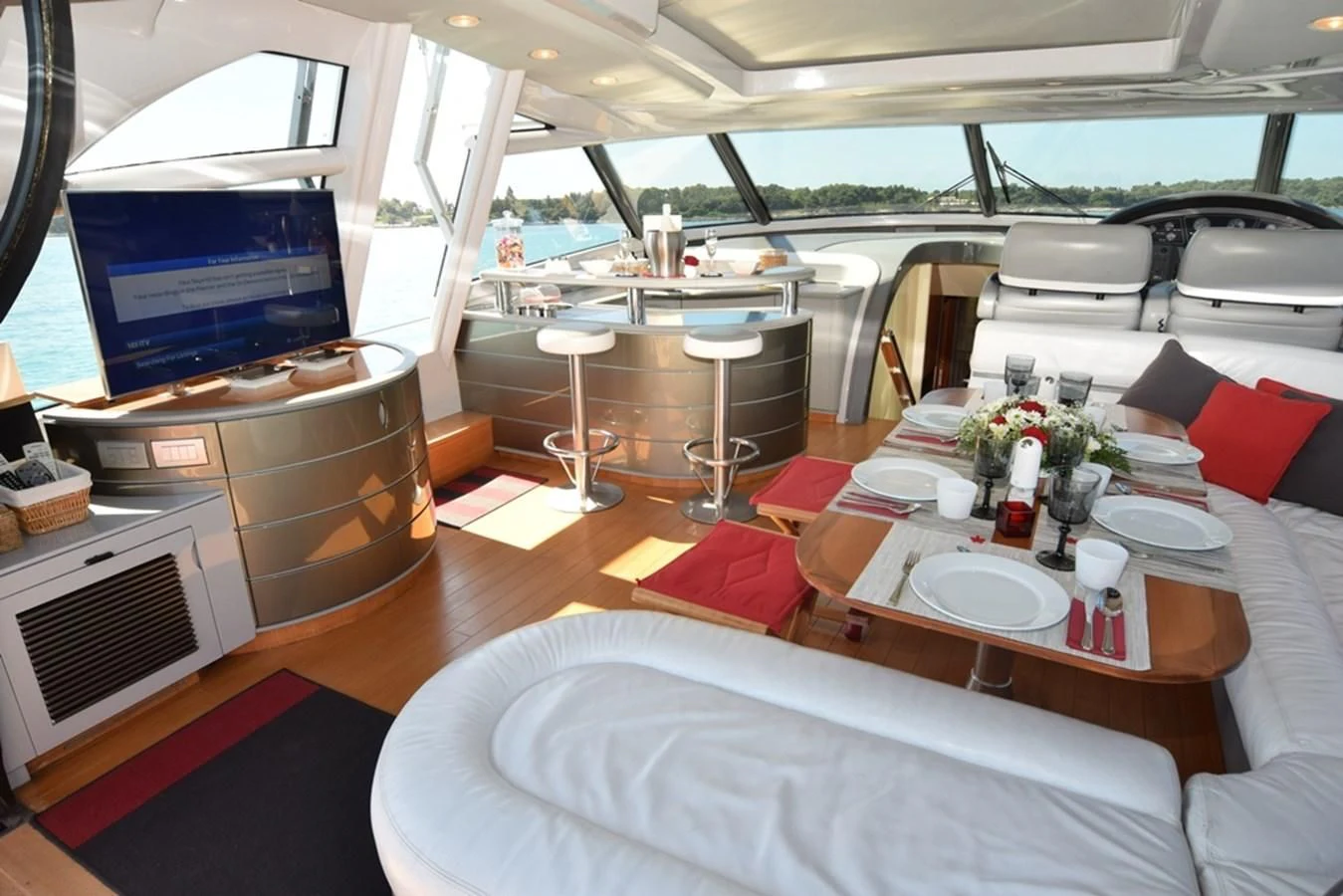 a room with tables and chairs aboard SUR L'ONDE 2 Yacht for Sale