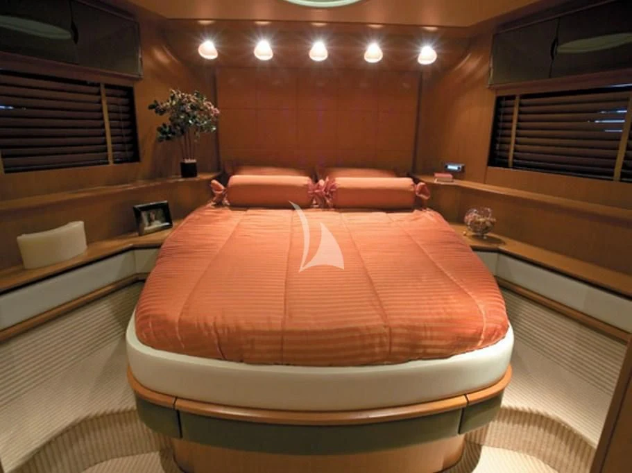 a bed in a room aboard SUR L'ONDE 2 Yacht for Sale