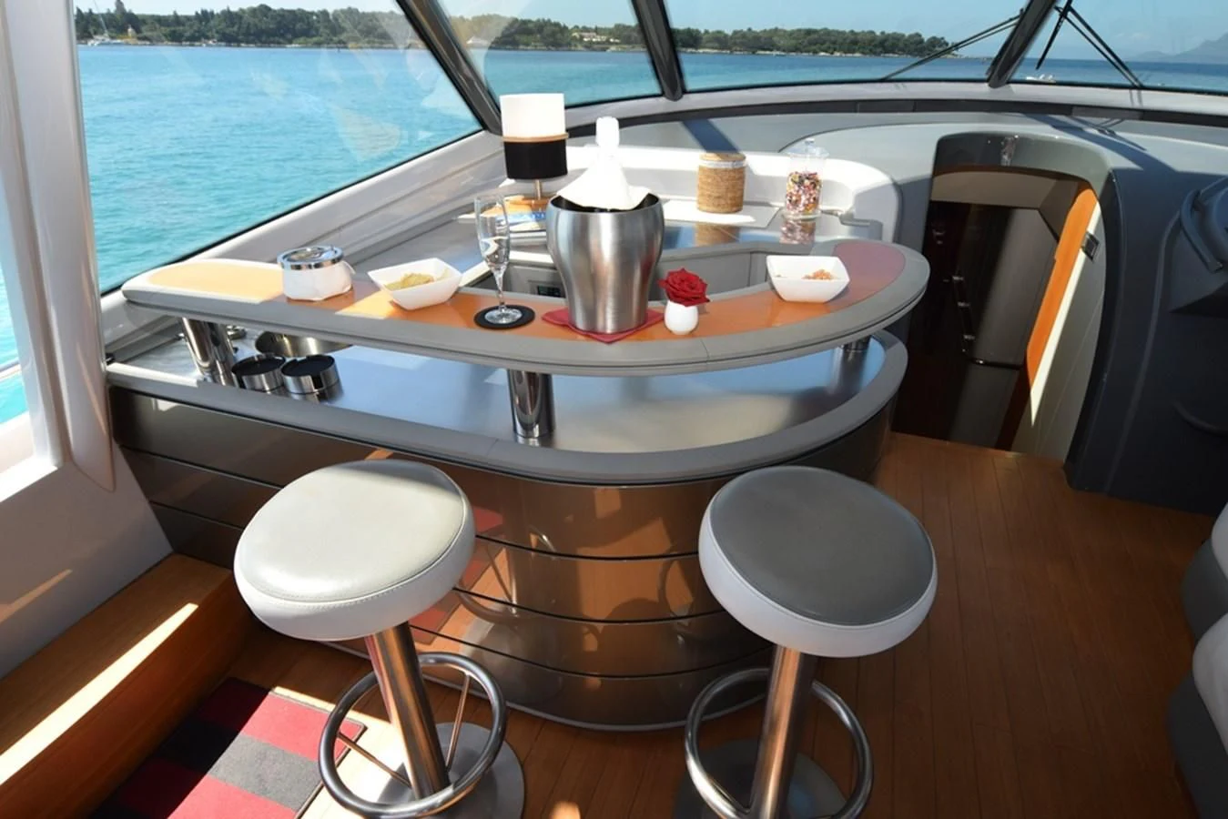 a table with cups and plates on it aboard SUR L'ONDE 2 Yacht for Sale