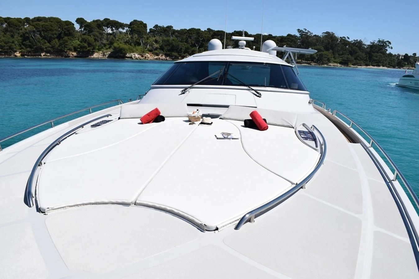 a white boat on a body of water aboard SUR L'ONDE 2 Yacht for Sale