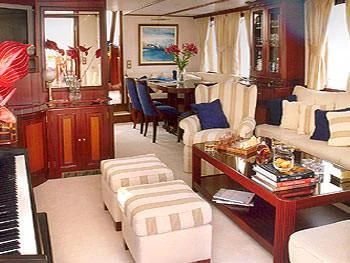 a living room with a table and chairs aboard LIANA H Yacht for Charter