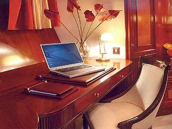 a laptop on a table aboard LIANA H Yacht for Charter