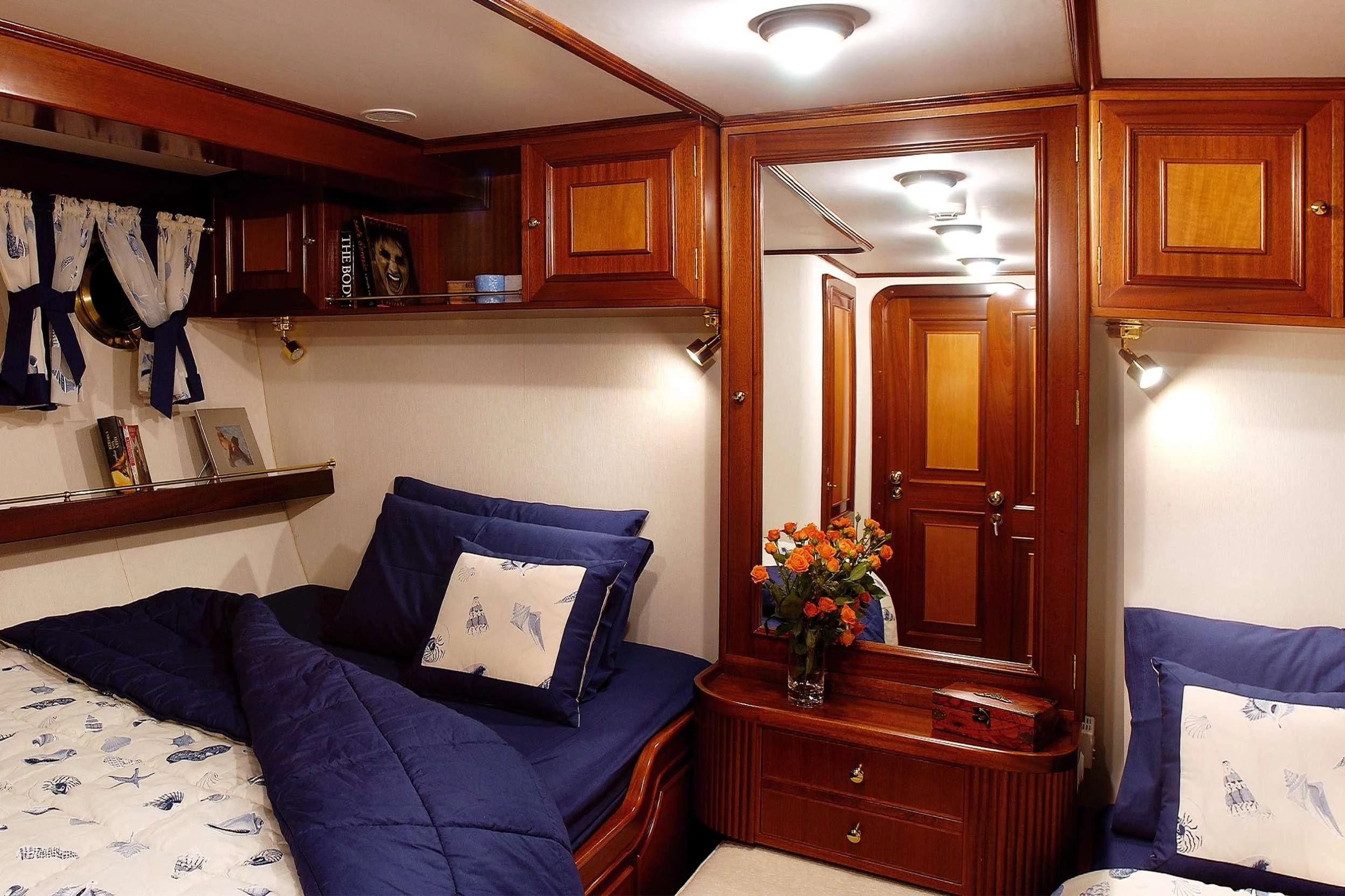 a bedroom with a blue couch aboard LIANA H Yacht for Charter