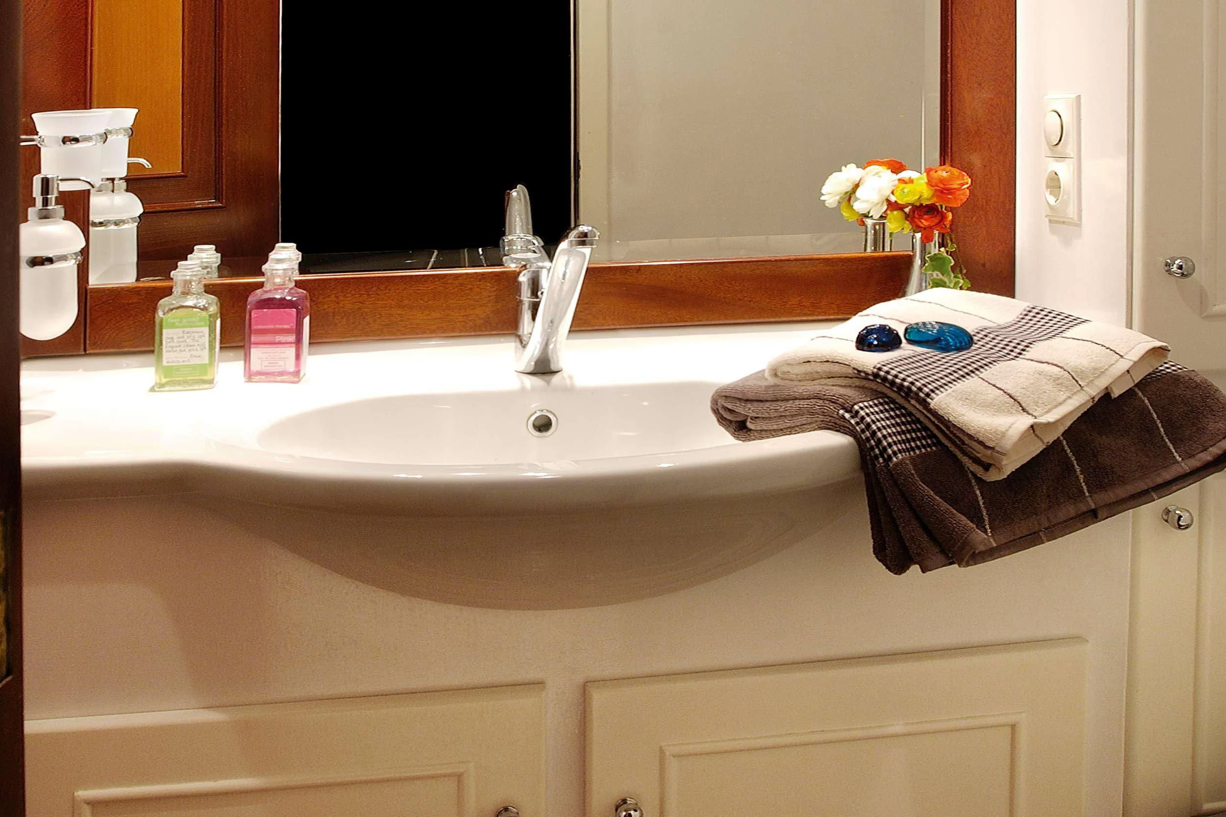 a bathroom sink with towels aboard LIANA H Yacht for Charter