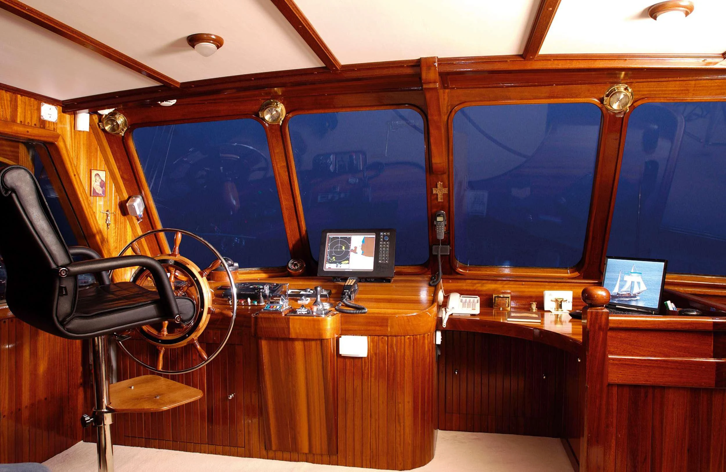 a room with a desk and computer aboard LIANA H Yacht for Charter