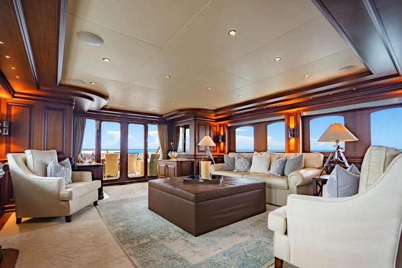 a living room with a large window aboard OMNIA 1 Yacht for Sale