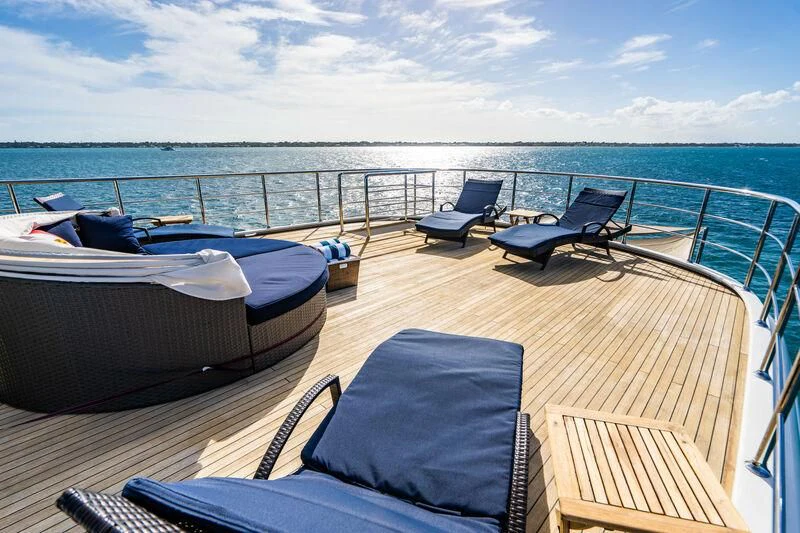 a deck with a view of the ocean and the ocean aboard OMNIA 1 Yacht for Sale