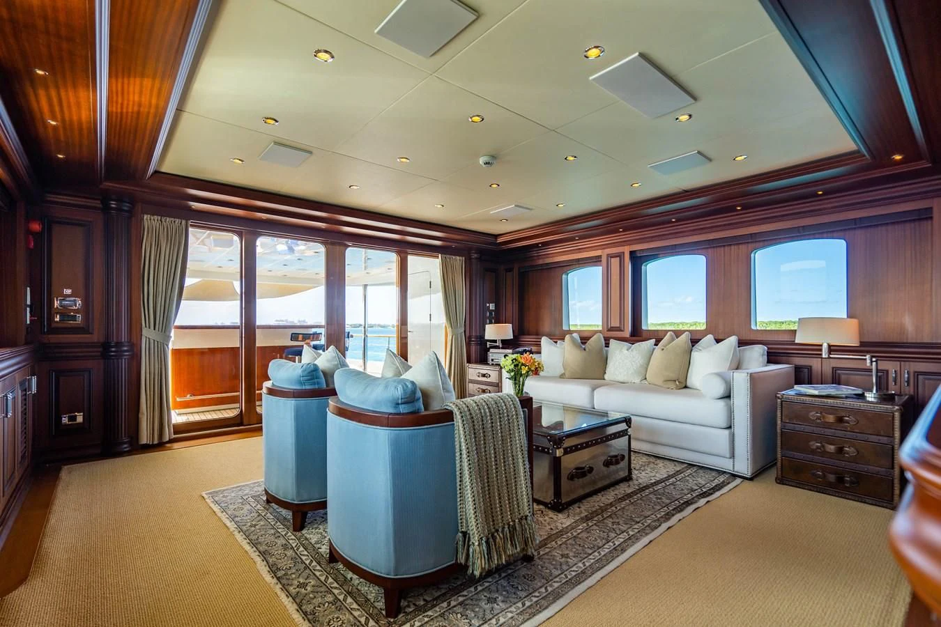 a living room with a large window aboard OMNIA 1 Yacht for Sale