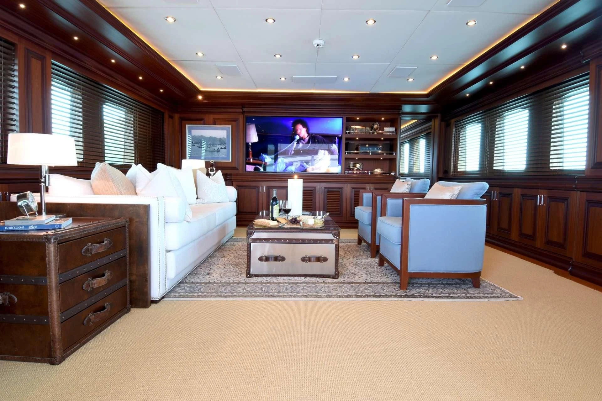 a living room with a large tv aboard OMNIA 1 Yacht for Sale