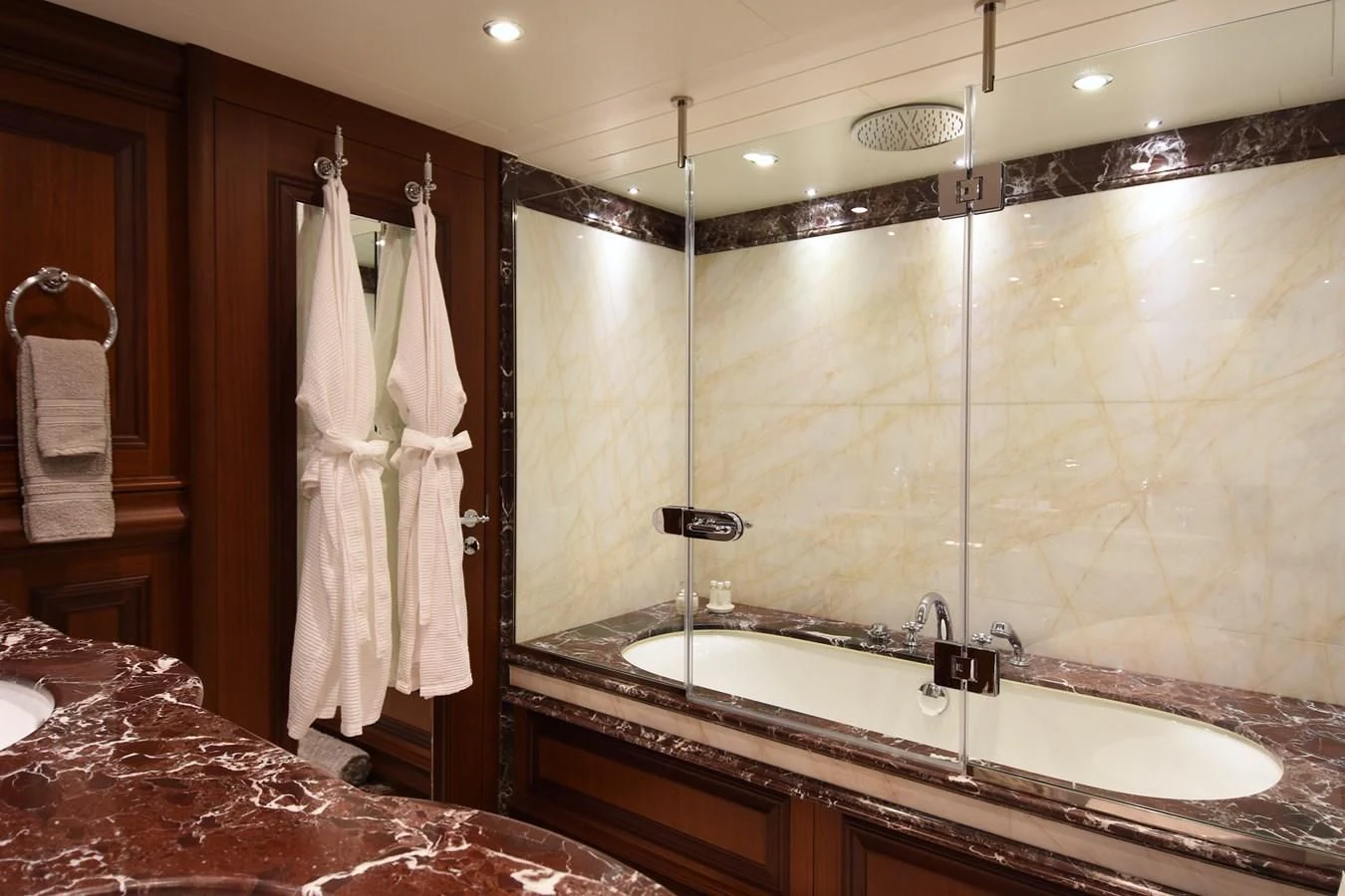 a bathroom with a large mirror aboard OMNIA 1 Yacht for Sale