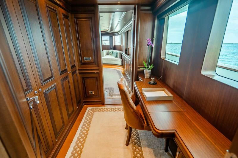 a room with a table and chairs aboard OMNIA 1 Yacht for Sale