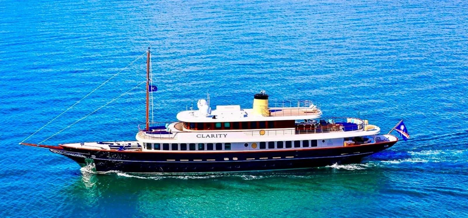 a large boat in the water aboard OMNIA 1 Yacht for Sale