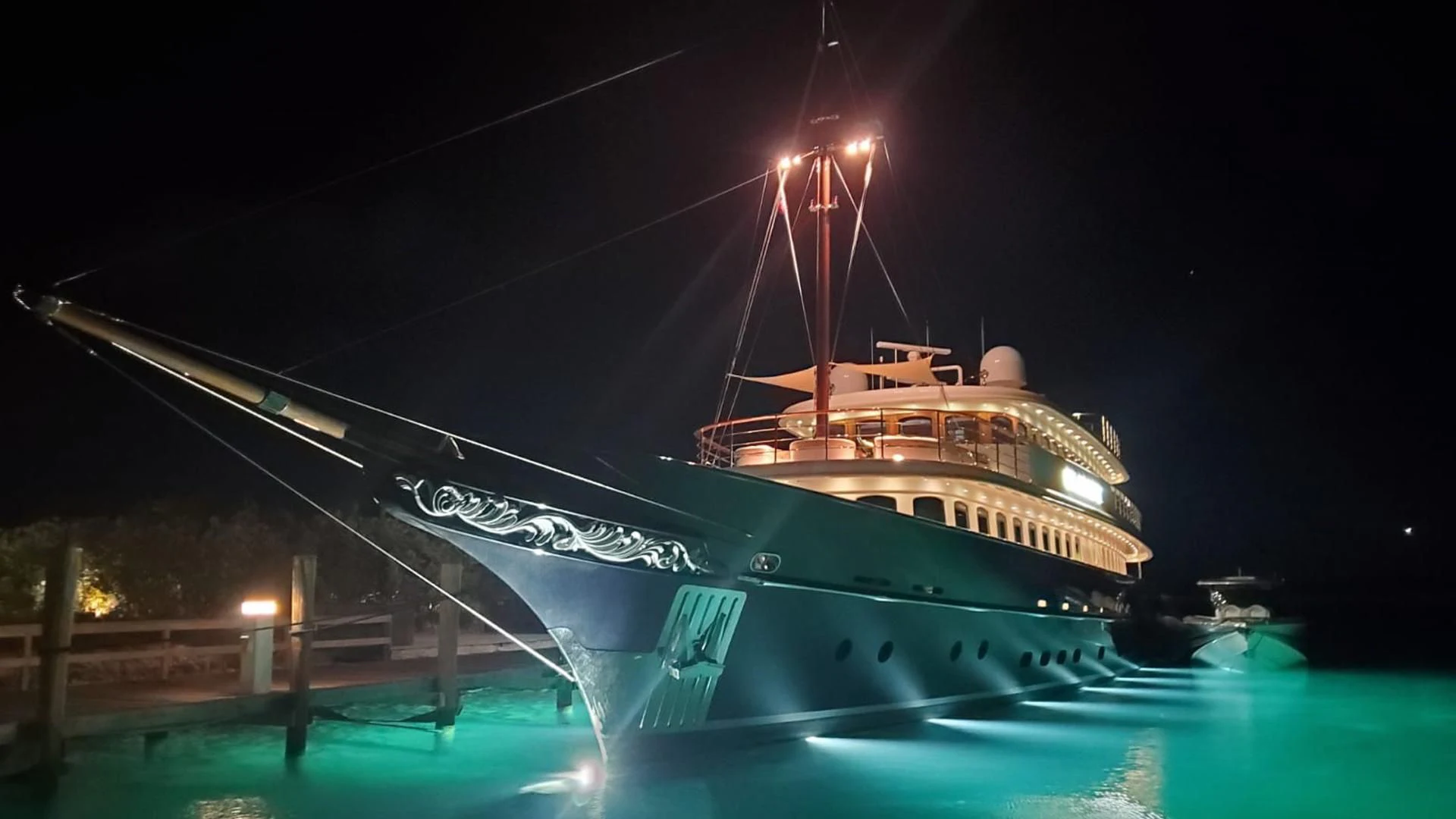 a large ship at night aboard OMNIA 1 Yacht for Sale