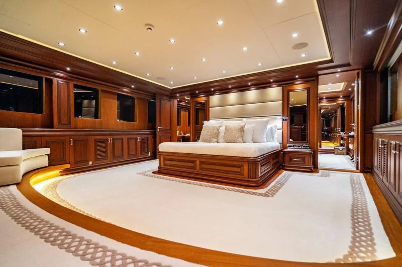 a large living room with a large bed aboard OMNIA 1 Yacht for Sale