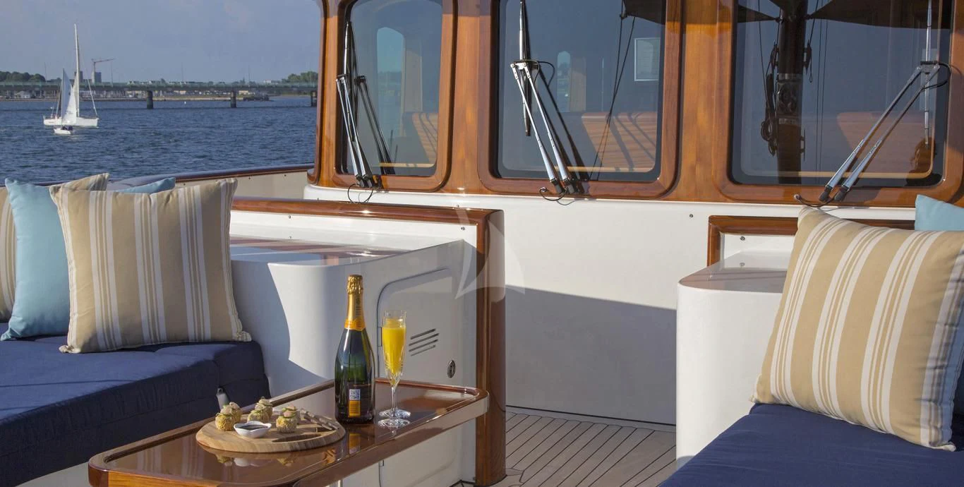 a glass bottle of wine on a boat aboard OMNIA 1 Yacht for Sale