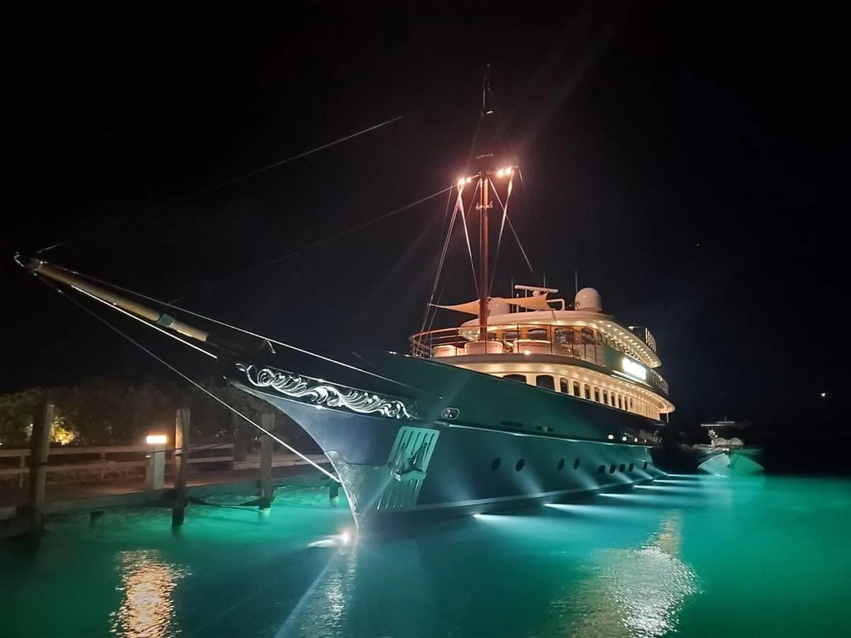 a large ship at night aboard OMNIA 1 Yacht for Sale