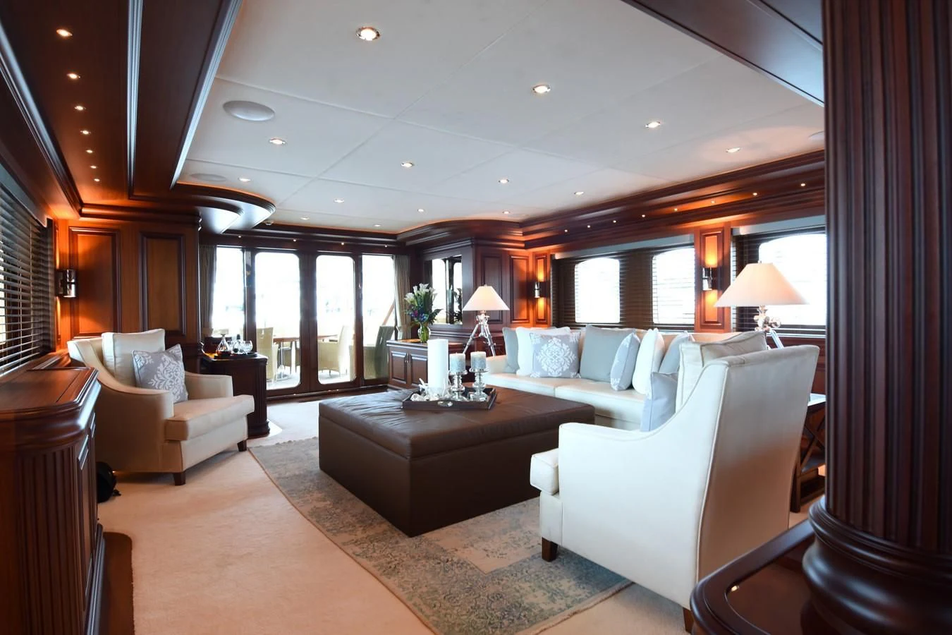 a living room with a large window aboard OMNIA 1 Yacht for Sale