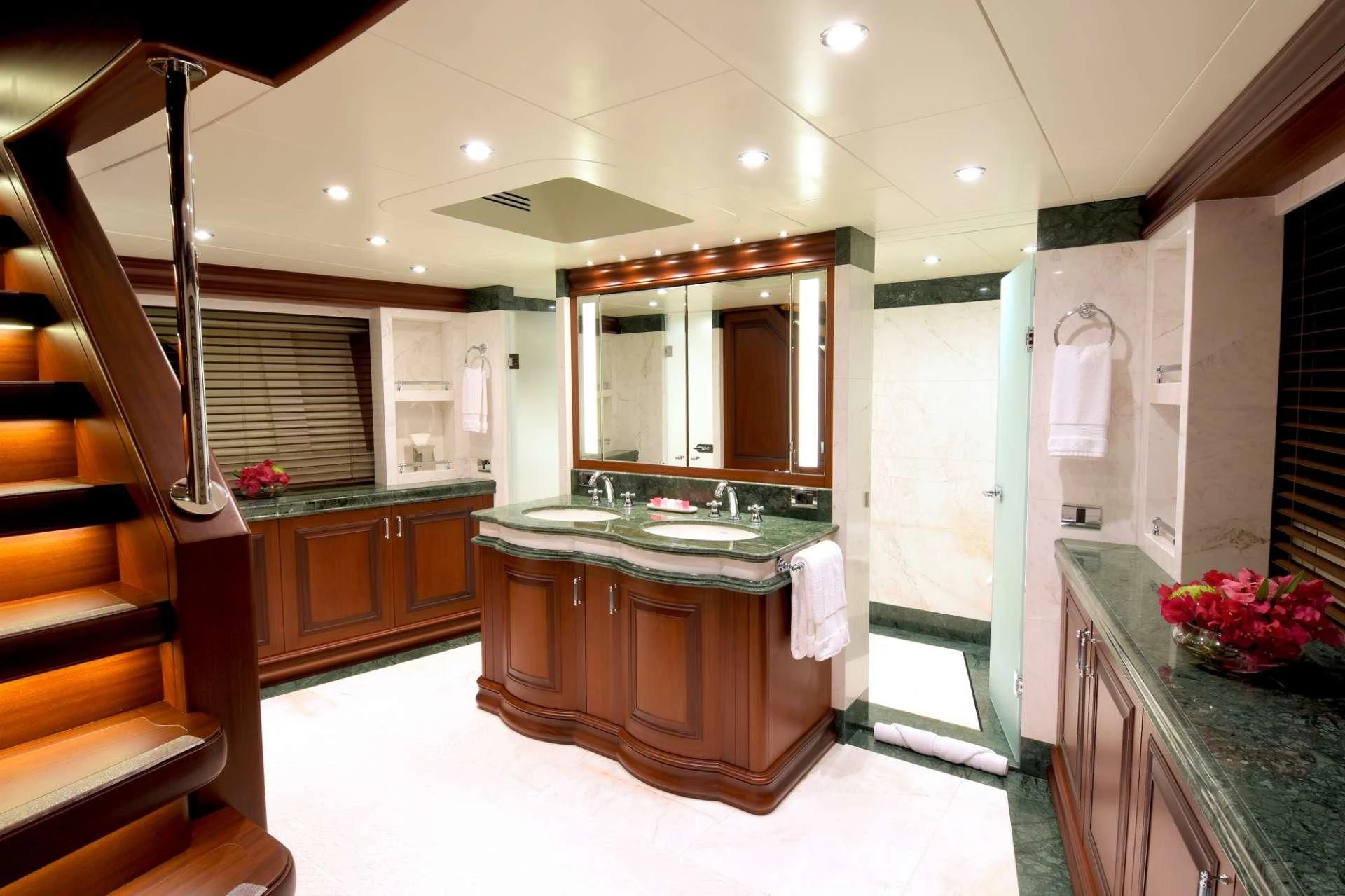 a bathroom with a large mirror aboard OMNIA 1 Yacht for Sale