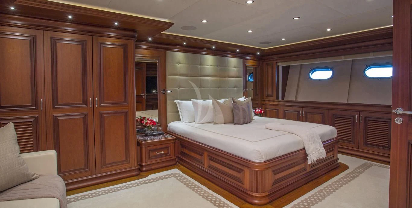 a hotel room with a bed aboard OMNIA 1 Yacht for Sale