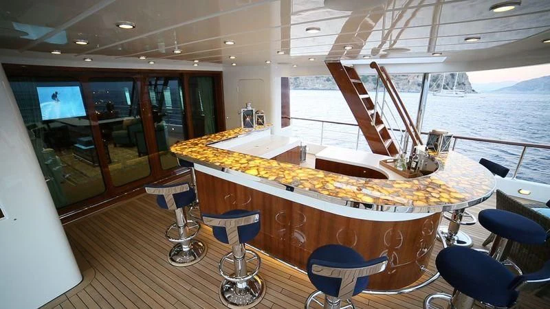 a room with a table and chairs aboard OMNIA 1 Yacht for Sale