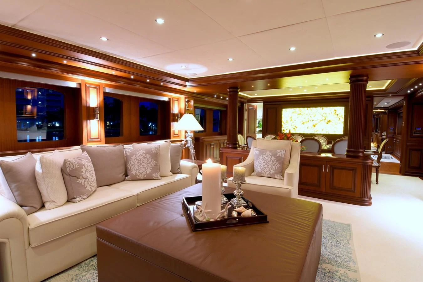 a large living room with a large mirror aboard OMNIA 1 Yacht for Sale