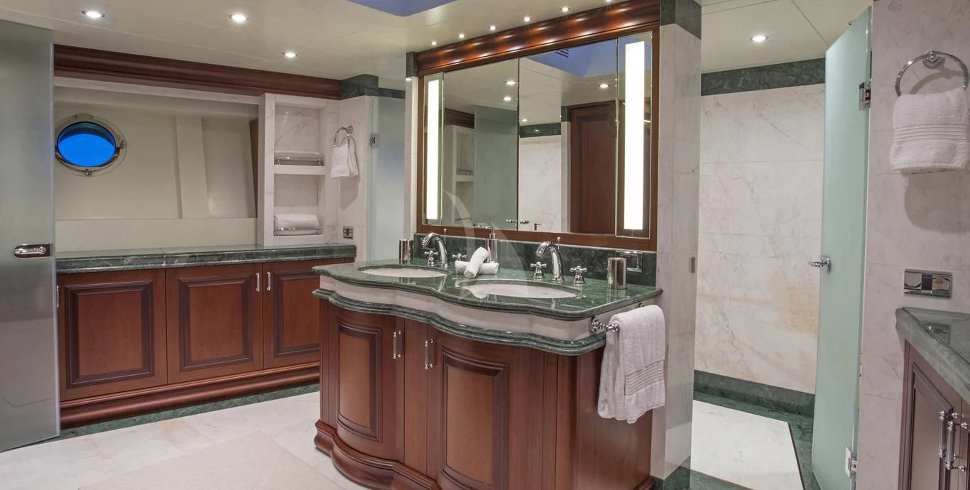 a bathroom with a sink and a mirror aboard OMNIA 1 Yacht for Sale