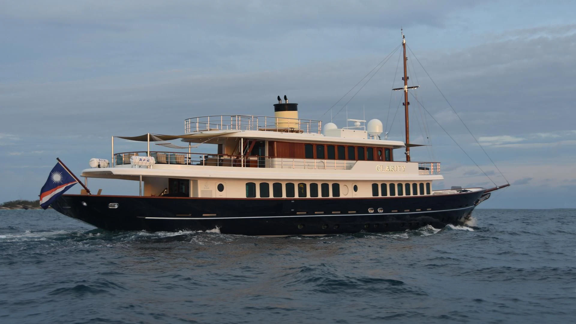 a large boat on the water aboard OMNIA 1 Yacht for Sale